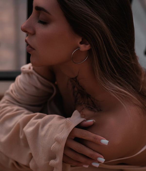 A serene woman with closed eyes, meditating in a calm environment.
